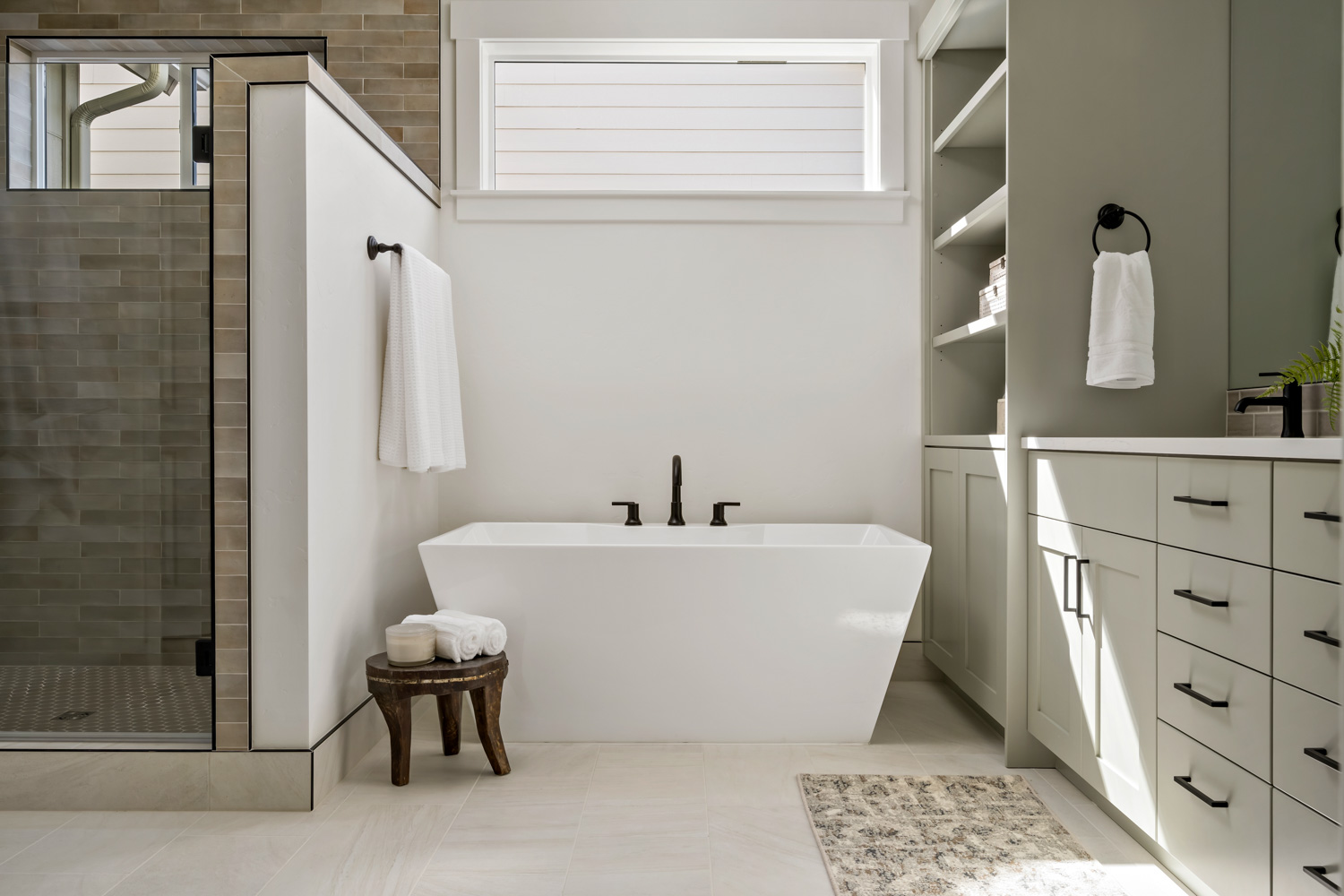 White laundry room with modern cabinetry and window in Boise Idaho new construction home