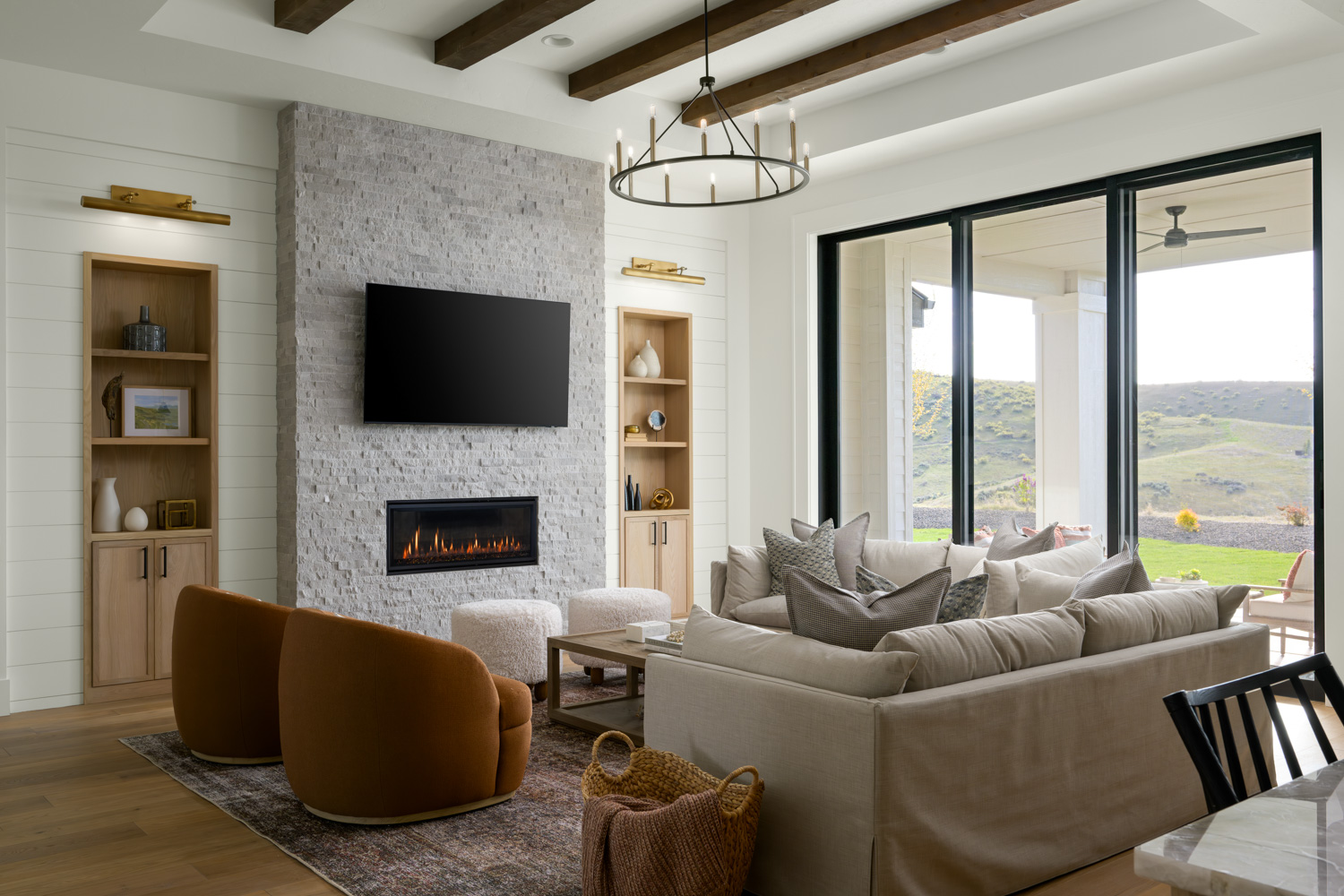 Modern living room with large sliding doors and mountain views in Bennett Valley Boise