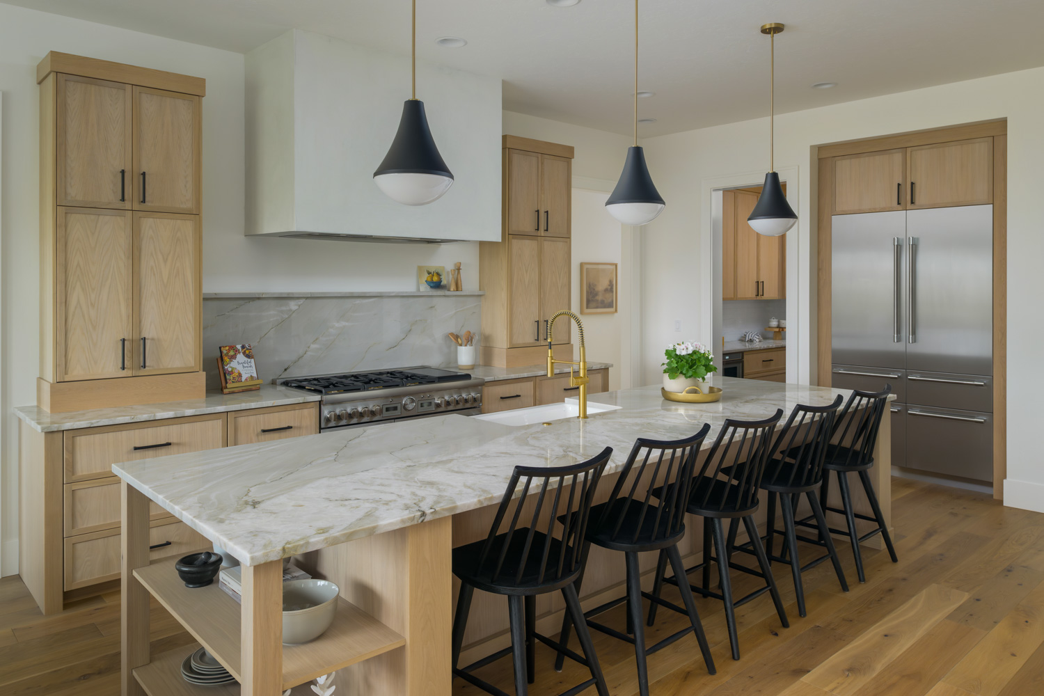 Modern farmhouse entryway with pendant lights and landscaped yard in Boise Idaho