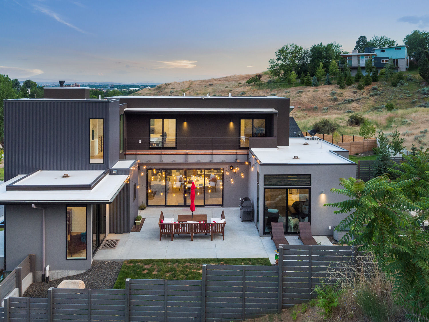 Aerial drone photo of Boise Idaho foothills with rolling golden hills at dusk