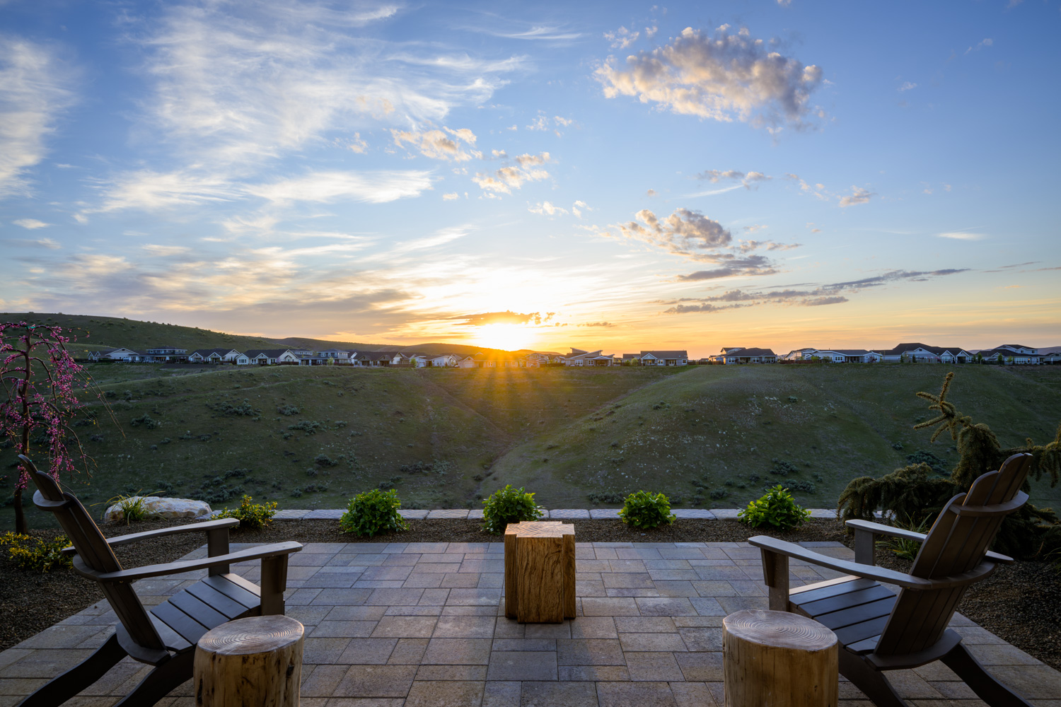 Living room with floor-to-ceiling windows and sunset foothills view in Boise Idaho