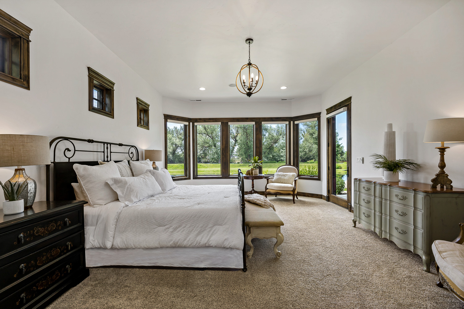 Luxury master bathroom with freestanding tub and chandelier in Eagle Idaho home