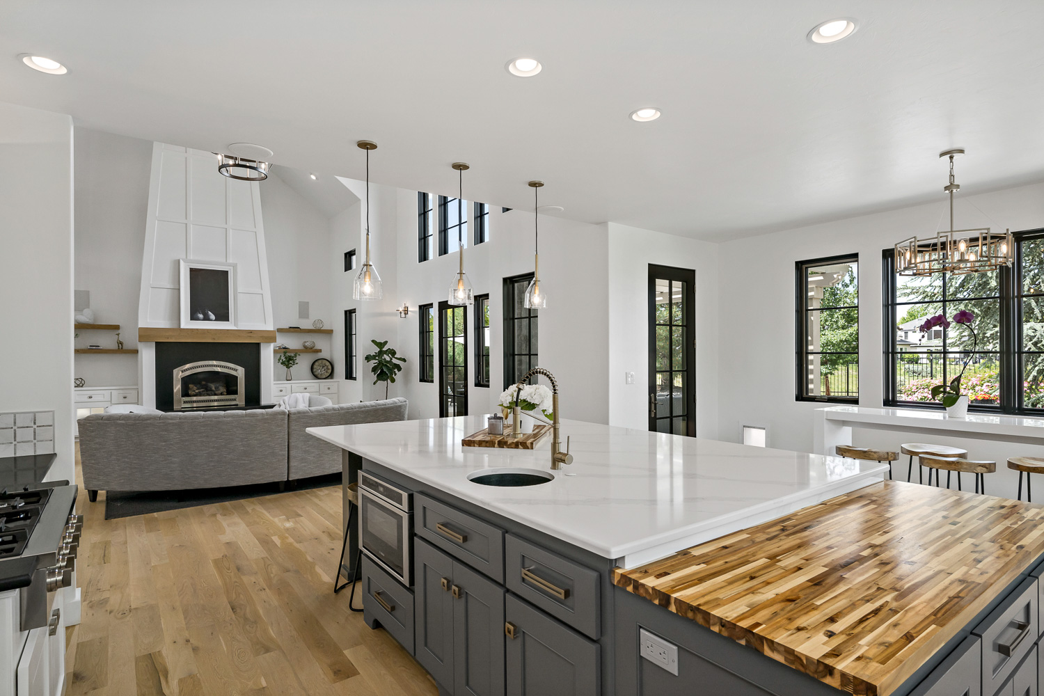 Luxury home rear exterior with covered porch and landscaped yard in Meridian Idaho