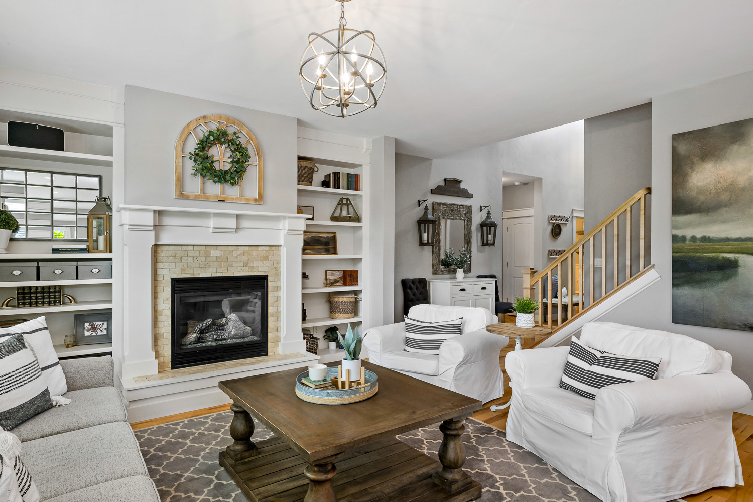 Bright living room with chandelier and shiplap walls in Eagle Idaho home