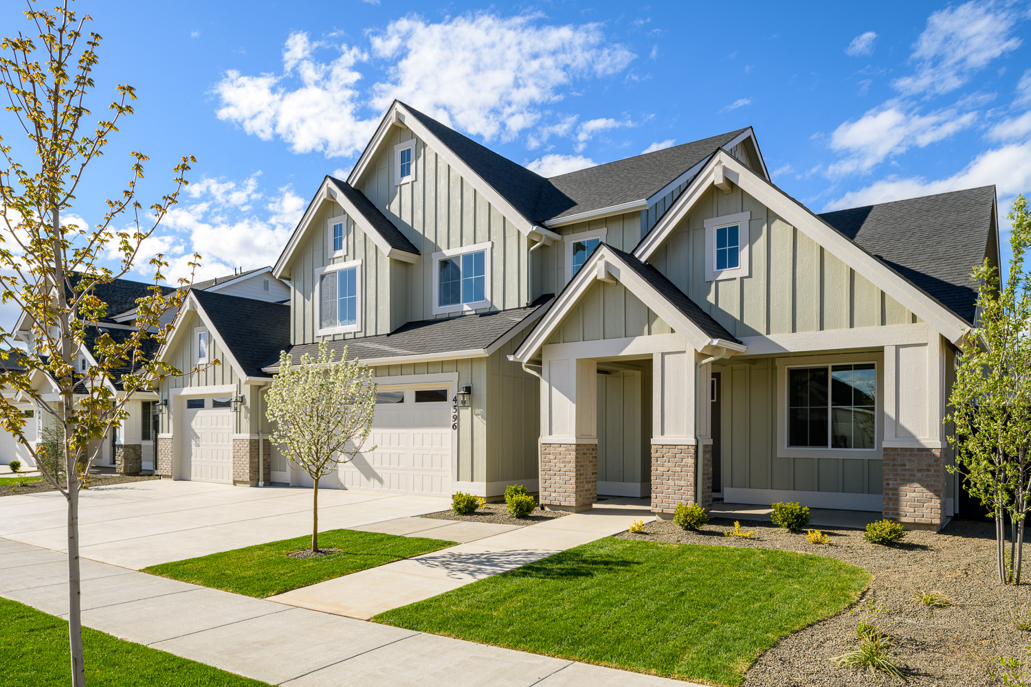 Contemporary new build home exterior with blue sky in Eagle Boise Idaho