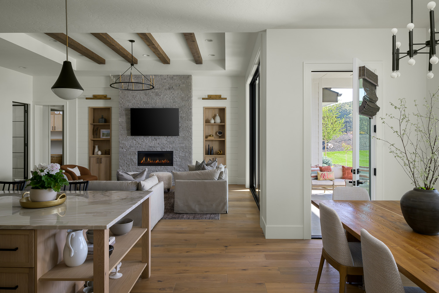 Open living room with vaulted ceiling and large windows in Boise Idaho property