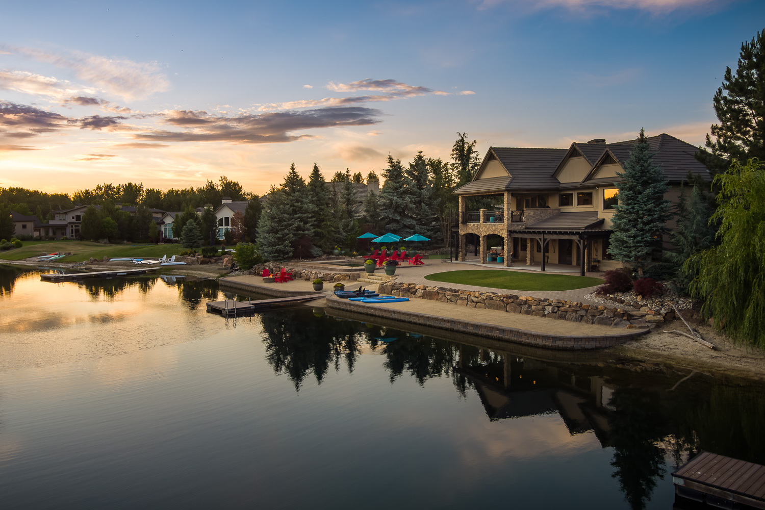Contemporary home exterior with blue sky and warm lighting at dusk in Boise Idaho