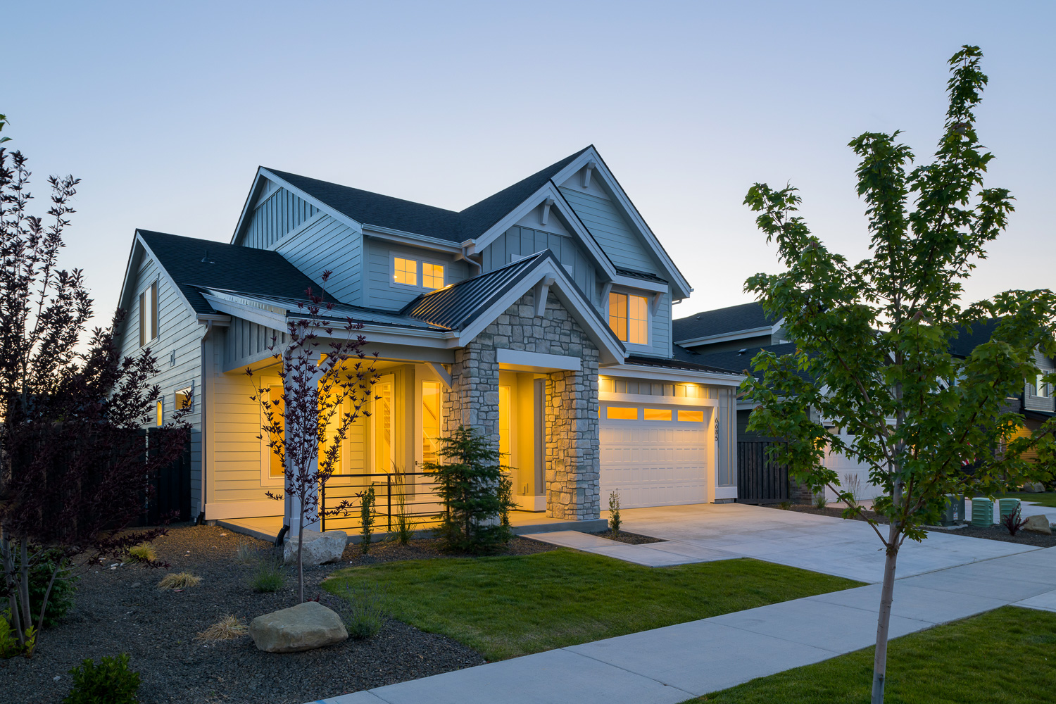Custom wood beam covered patio at luxury Eagle Idaho home at dusk