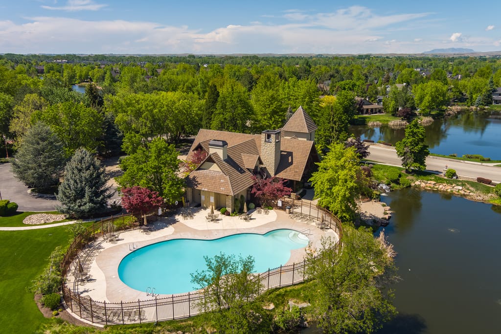 Aerial view of luxury estate on large wooded lot in Boise Idaho neighborhood