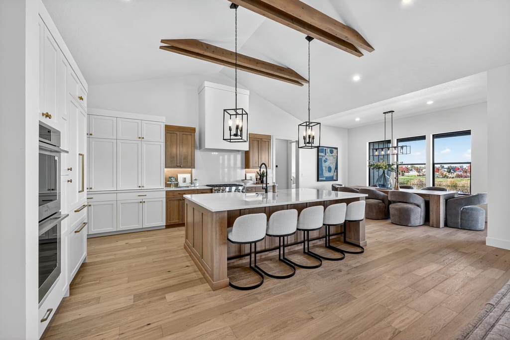 Open concept great room with wood beam ceiling and modern finishes in Boise Idaho