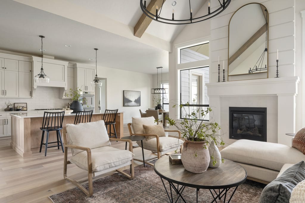 Modern farmhouse kitchen with arched range hood and white cabinetry in Boise Idaho