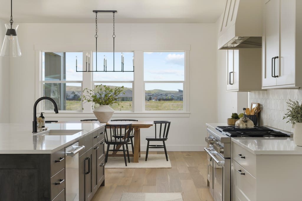 Open dining area and kitchen with mountain views through large windows in Boise Idaho