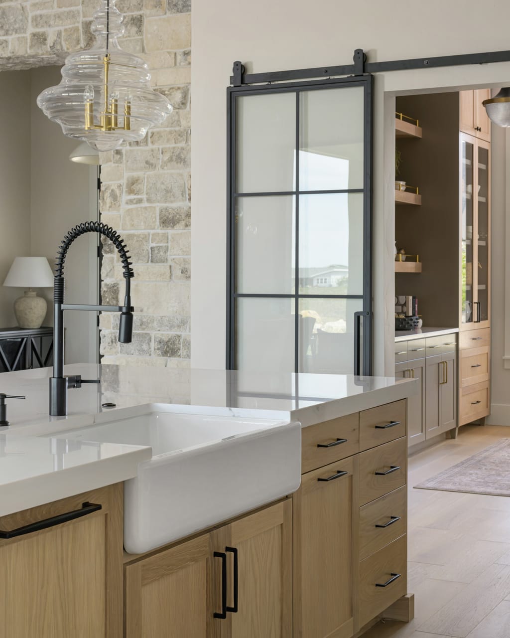 Bright white kitchen with gold fixtures and marble countertops in Boise Idaho home