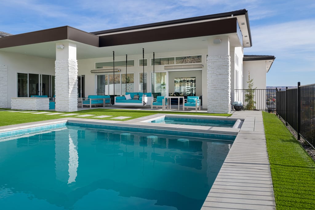 Modern backyard with swimming pool artificial turf and mountain views in Boise Idaho