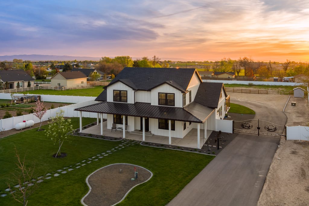 Aerial drone view of green farmland and rural properties near Boise Idaho