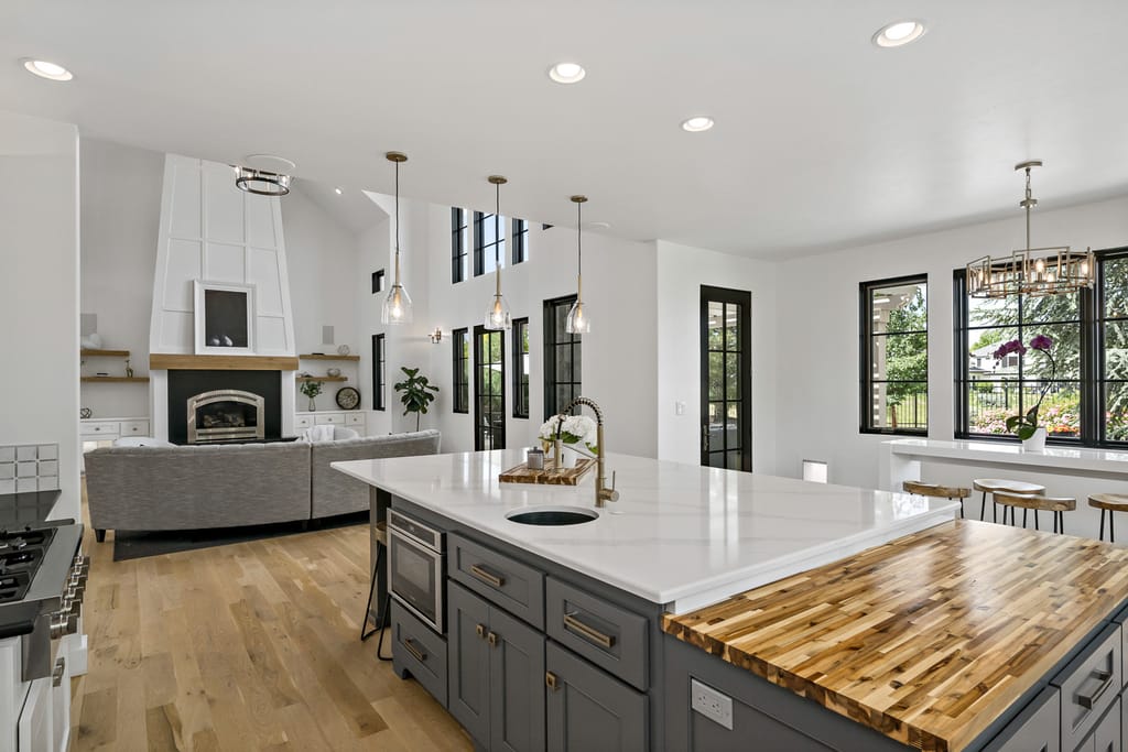 Luxury home rear exterior with covered porch and landscaped yard in Meridian Idaho