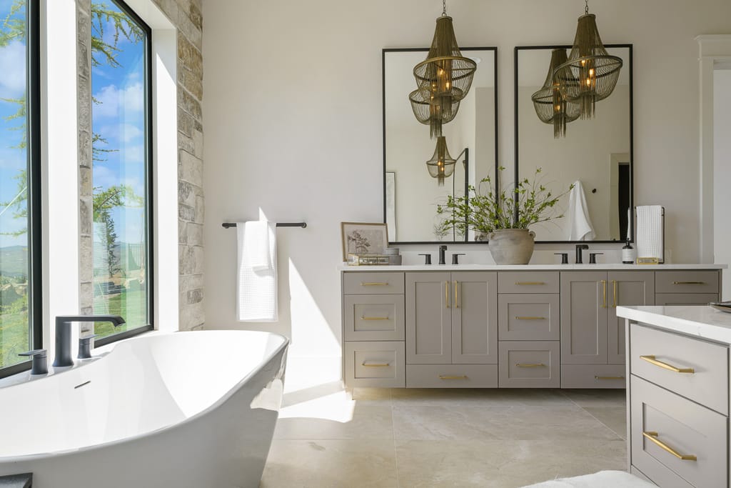 Bright elegant entryway with chandelier and staircase in Meridian Idaho home