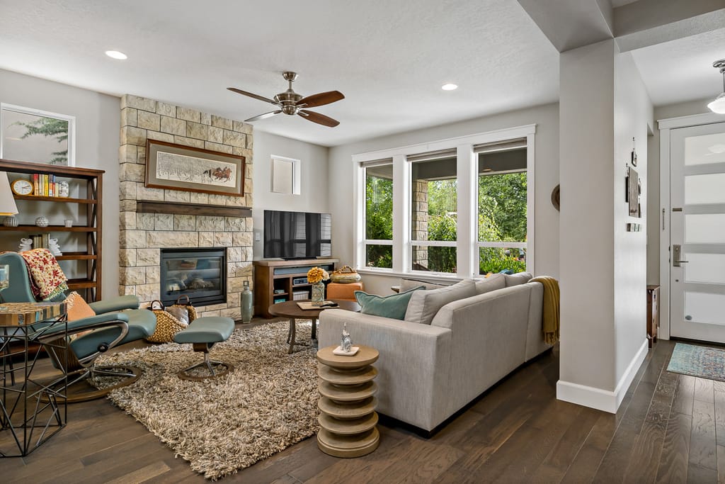 Spacious living room with large windows and farmhouse decor in Meridian Idaho home