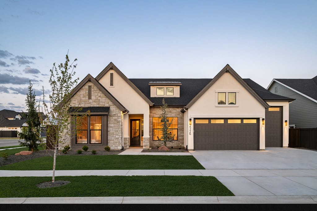Modern farmhouse exterior with stone and board-and-batten siding in Boise Idaho