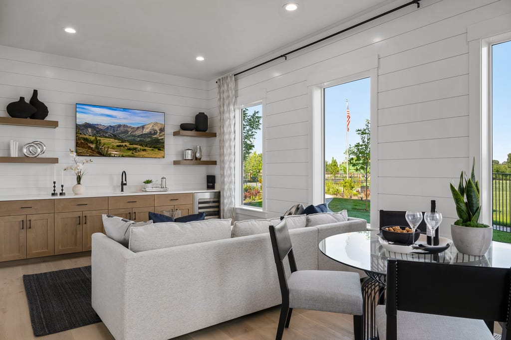 Twilight exterior of modern craftsman home with lit interior in Eagle Idaho