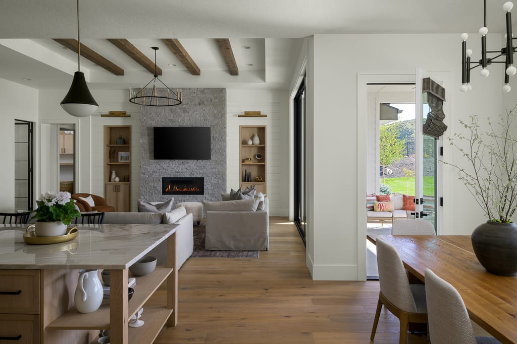 Open living room with vaulted ceiling and large windows in Boise Idaho property