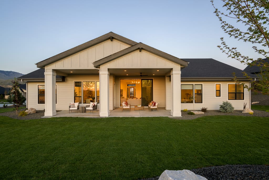Modern home exterior with wood and stone accents at dusk in Eagle Boise Idaho