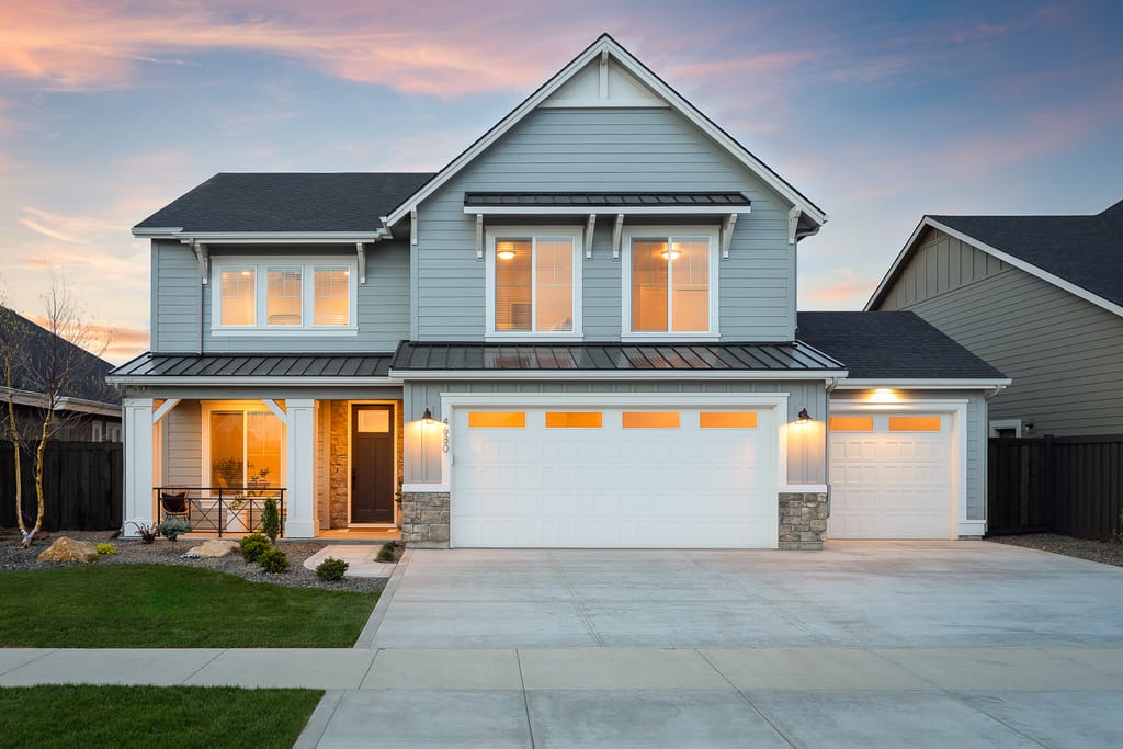 Waterfront luxury home with pond and fountain at sunset in Boise Idaho