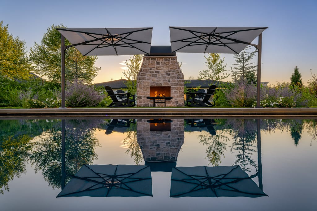 Single-story home with dark siding and attached garage at dusk in Boise Idaho