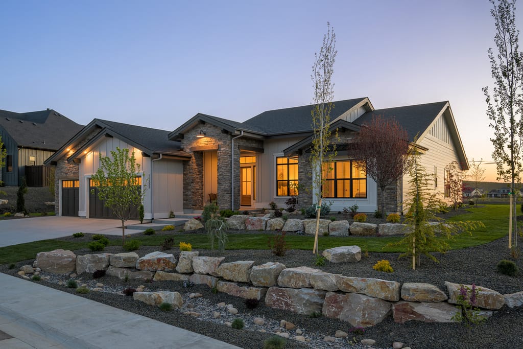 Master bedroom with chandelier and elegant decor at twilight in Meridian Idaho home